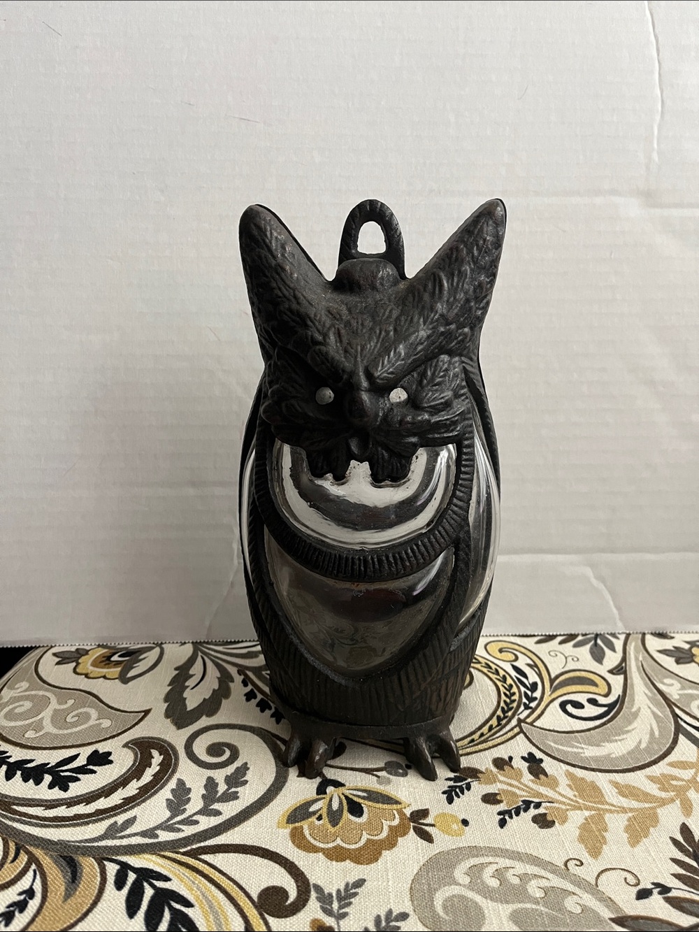 Cast iron owl candle holder lantern with hand blown glass.